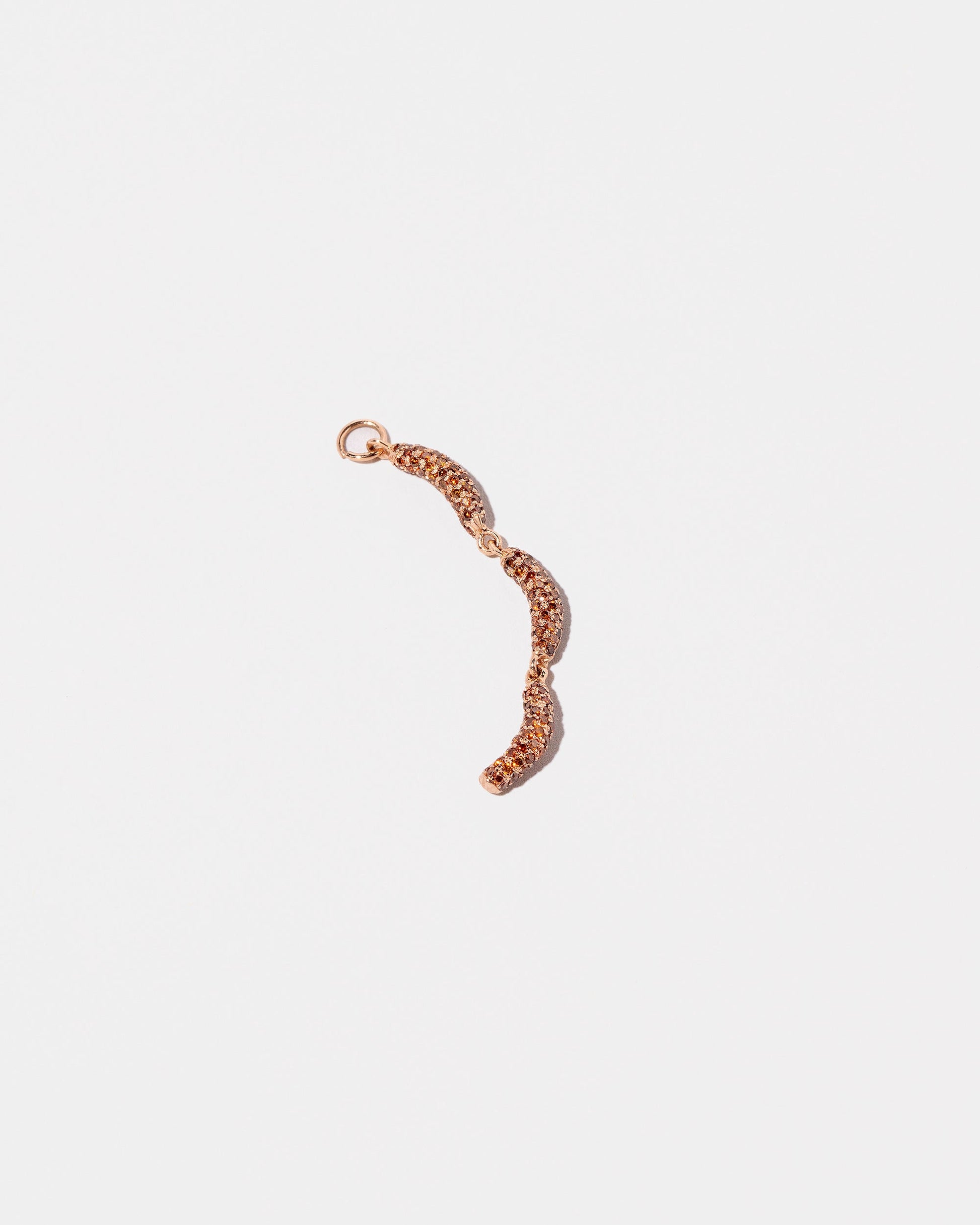 Sausage Links Charm on light color background.