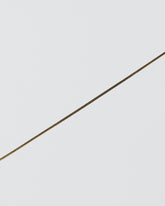 Liquid Chain Bracelet on light color background.