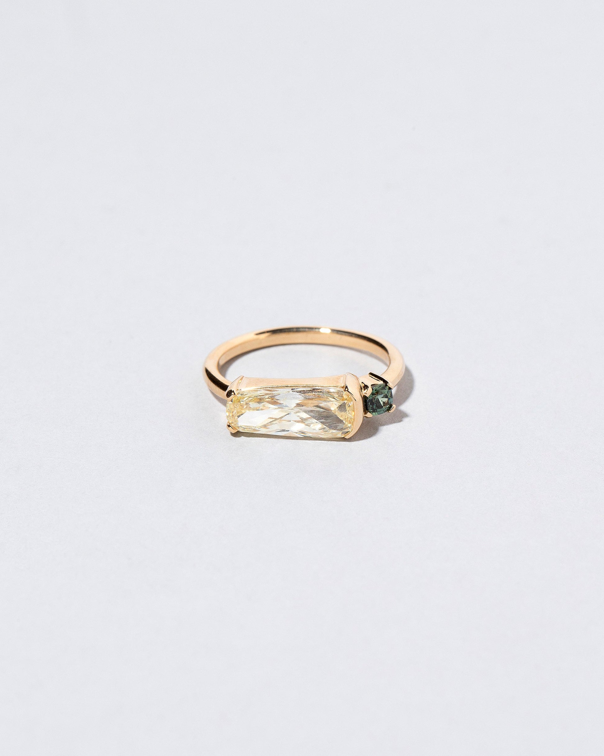 Immanence Ring on light color background.