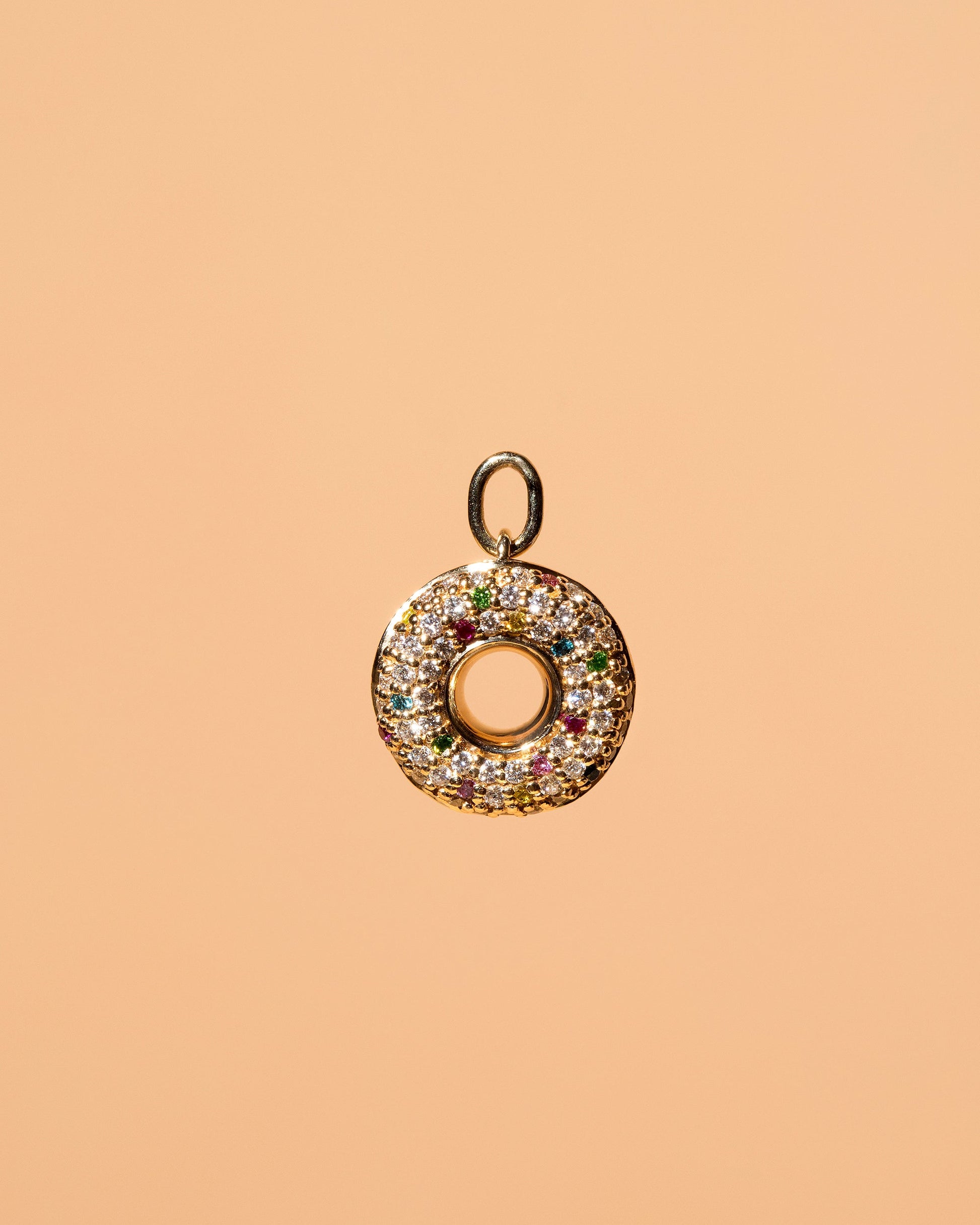Strawberry Sprinkle Donut Charm on light color background.