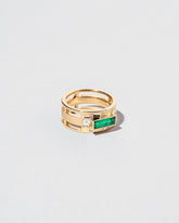 Sleeping Figure Ring on light color background.