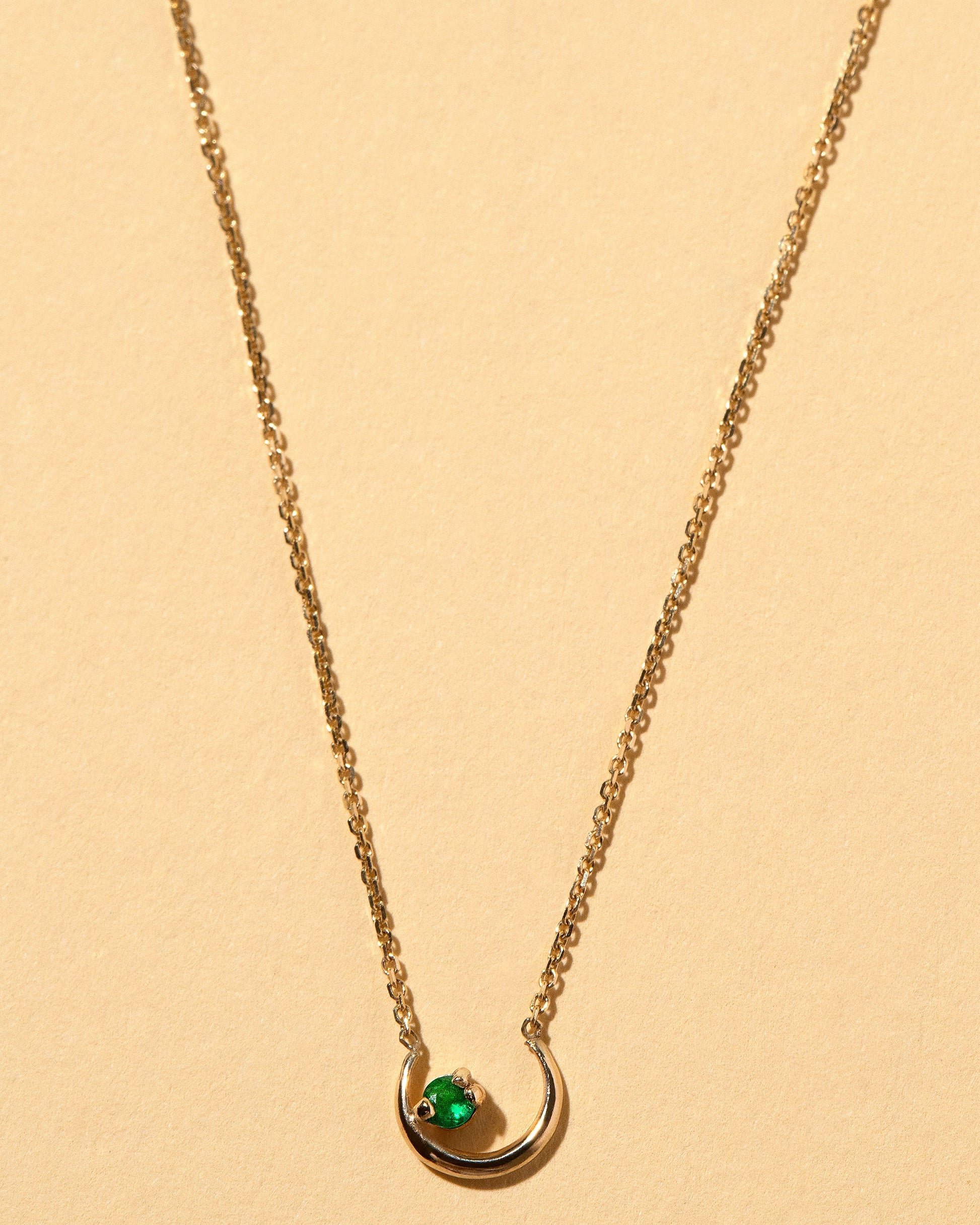 Moon Ray Necklace on light color background.