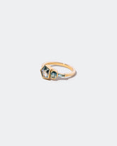 Syncretism Ring on light color background.