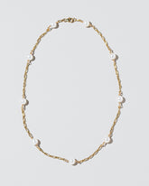 Pearl Station Necklace on light color background.