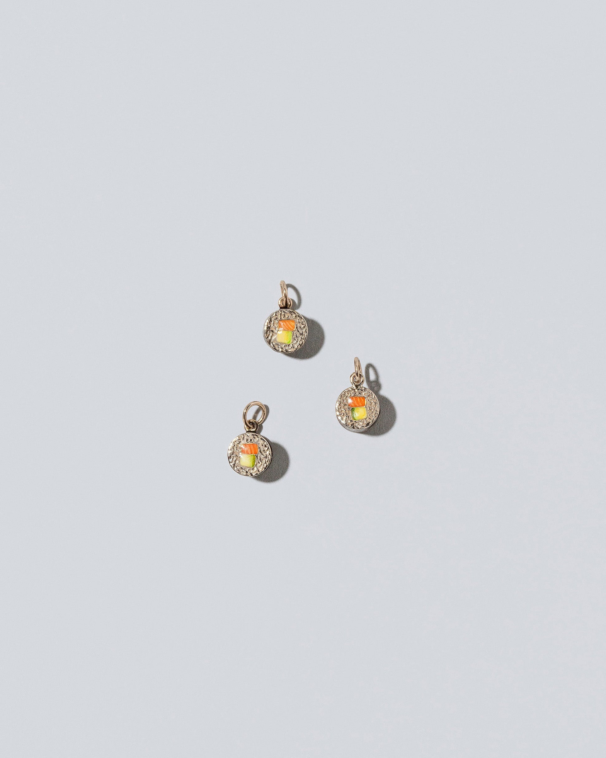 Sushi Charms on light color background.