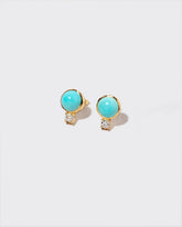 In-Between Earrings on light color background.