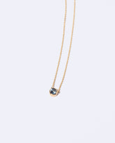 Razor Necklace on light color background.
