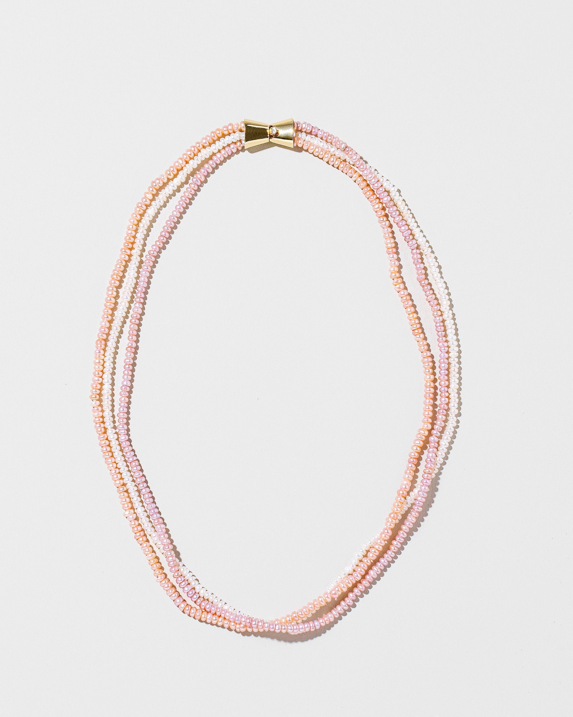 Multi Strand Seed Pearl Choker on light color background.