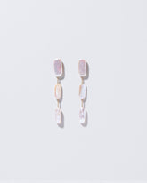  Pelias Earrings on light color background.