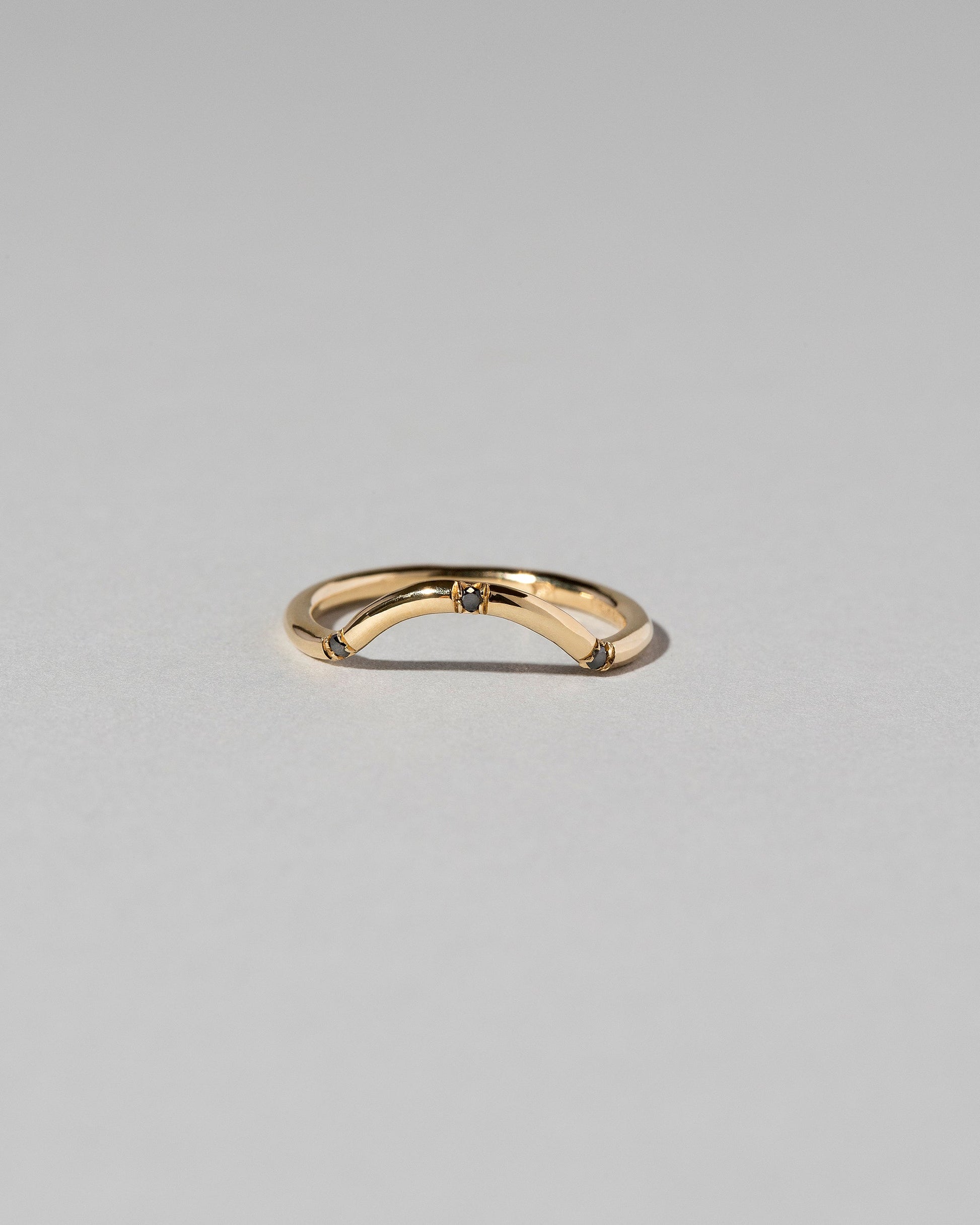 Mini Curve Band - Three Stone on light color background.