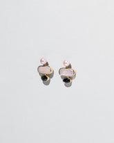 Mantle Earrings on light color background.