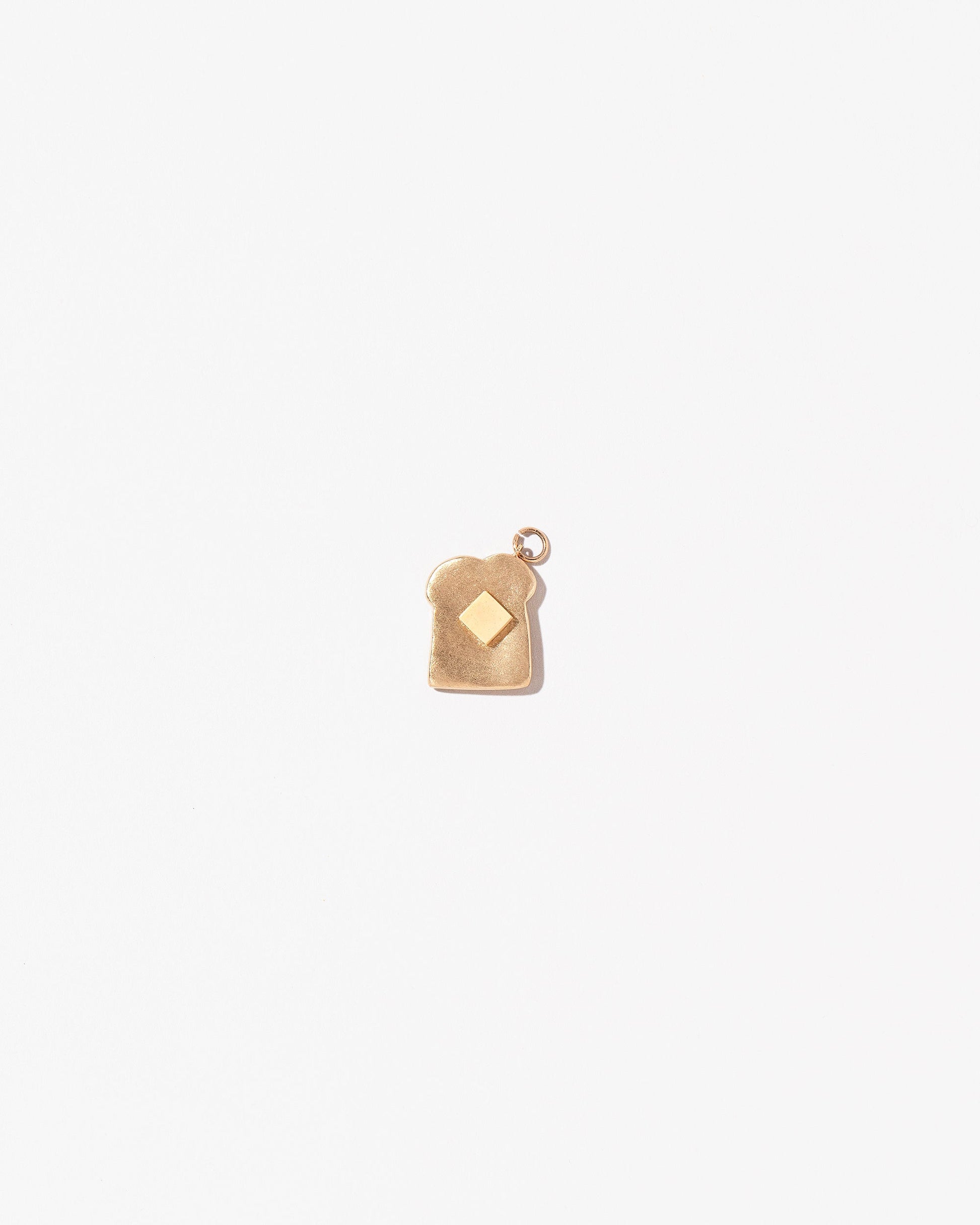Toast Charm - with Butter on light color background.