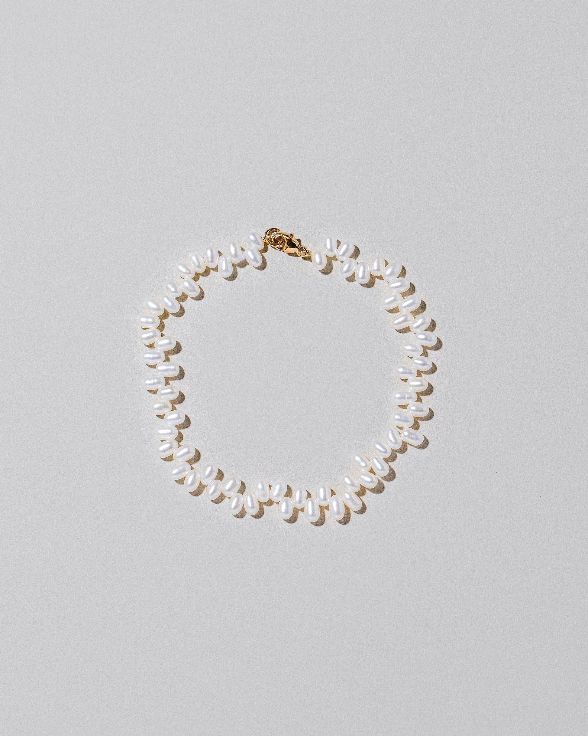  Zipper Pearl Bracelet on light color background.