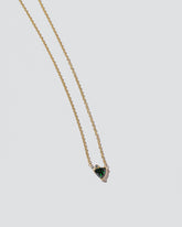 Rise Necklace on light color background.
