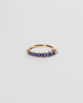 Blue Sapphire Eleven Trillion Ring on light color background.