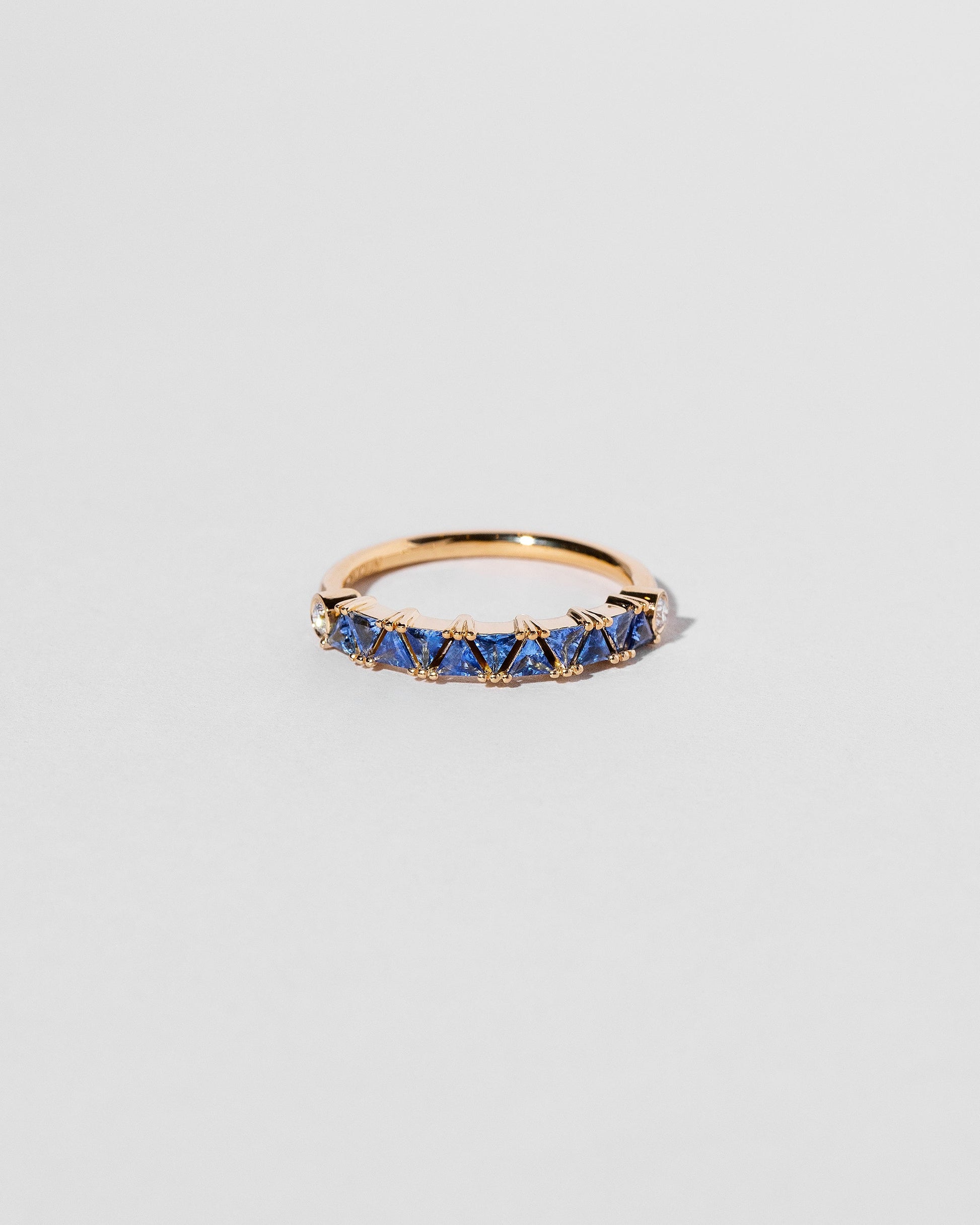 Blue Sapphire Eleven Trillion Ring on light color background.