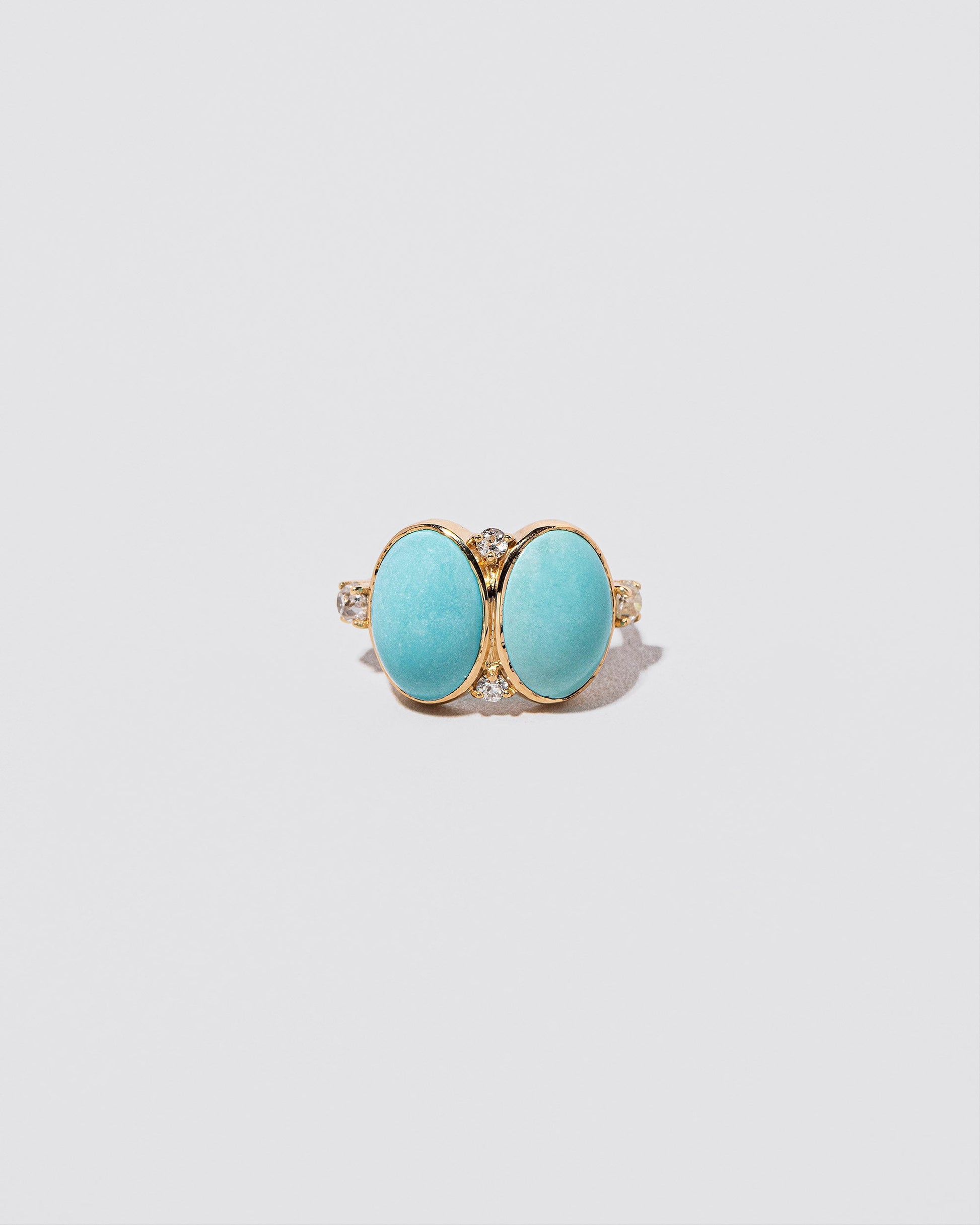 In-Between Ring on light color background.