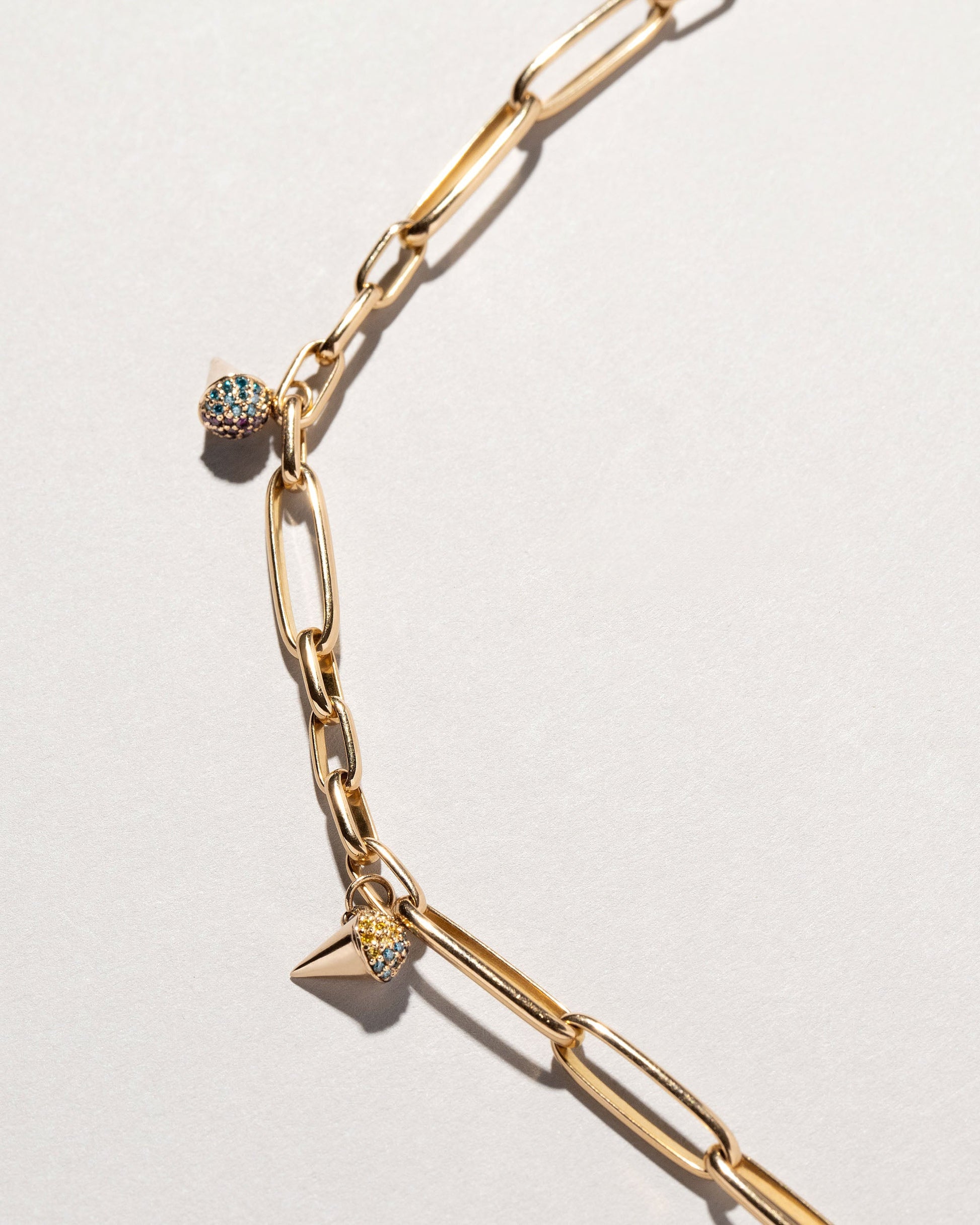 Sno Cone Charm - Blue Raspberry & Blackberry on light color background.