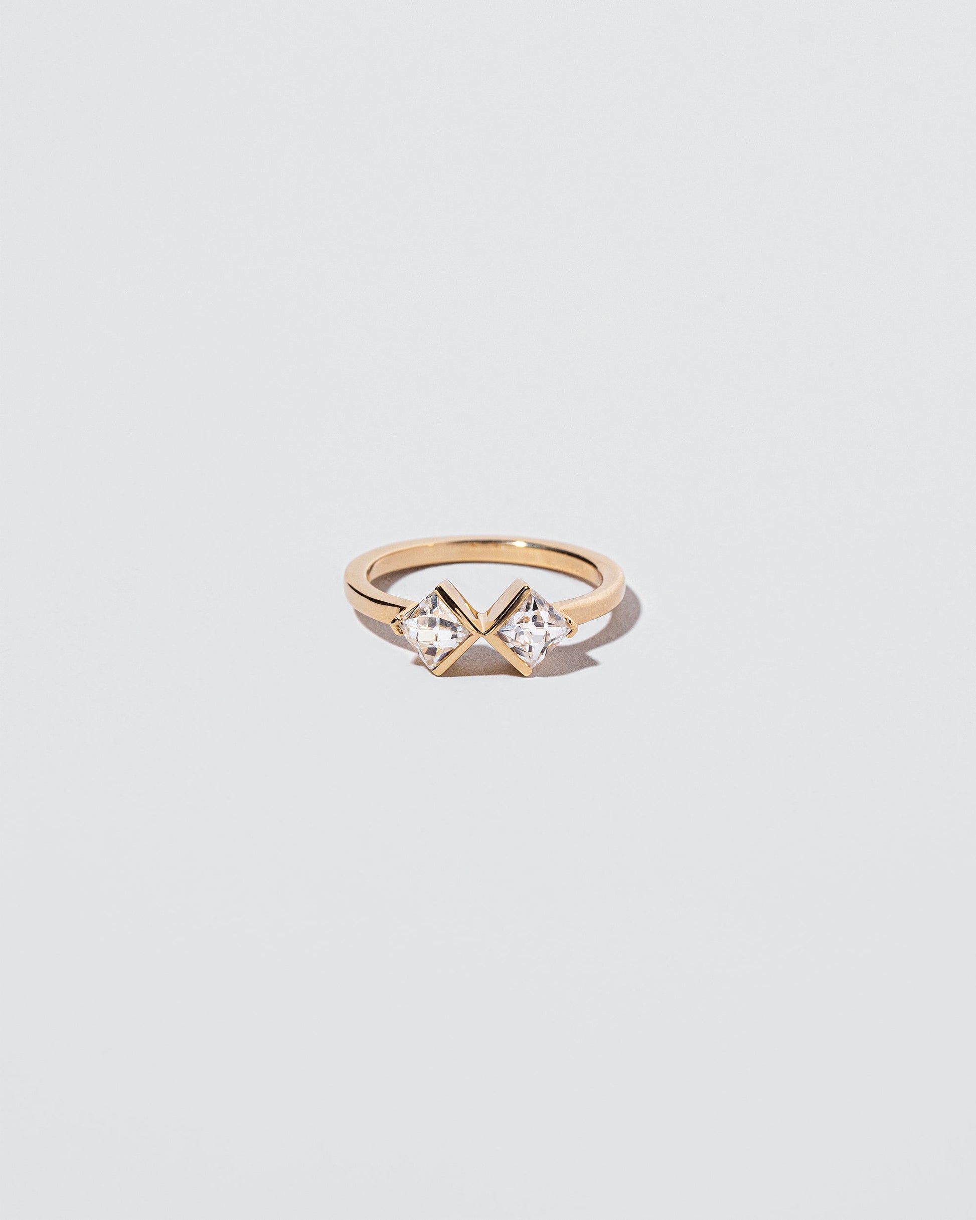 Rise & Fall Ring on light color background.