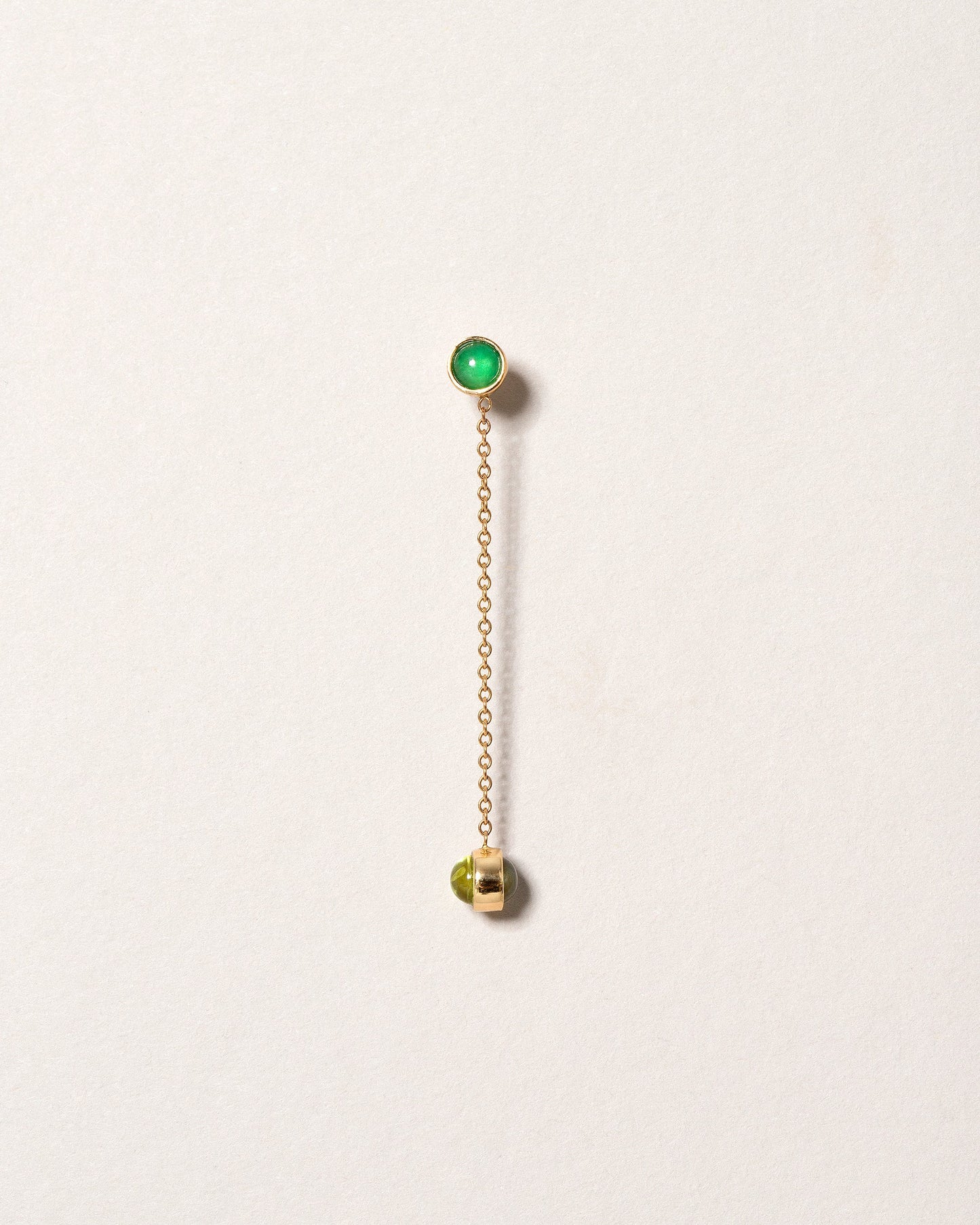 Birthstone One-Drop Single Earring on light color background.