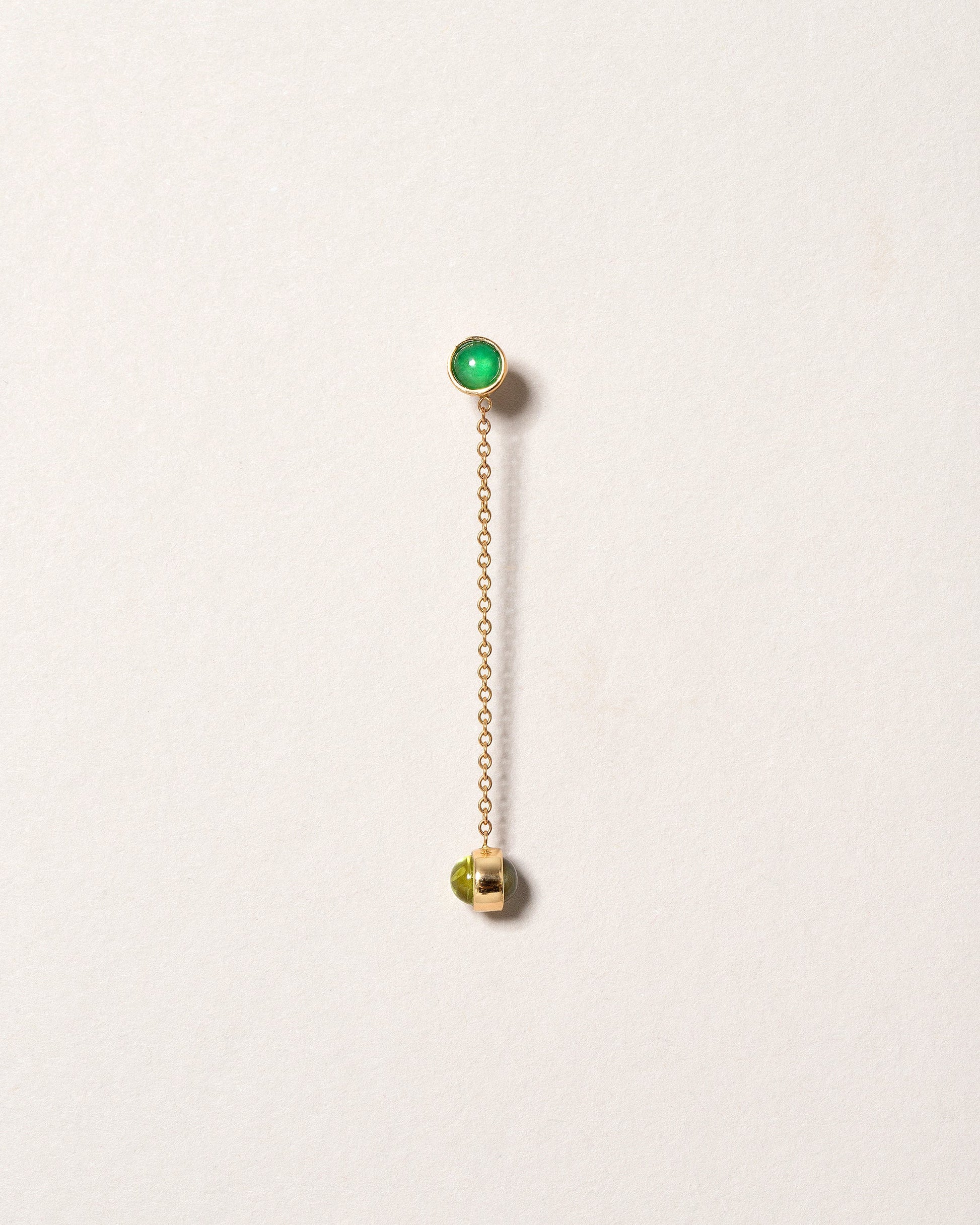 Birthstone One-Drop Single Earring on light color background.