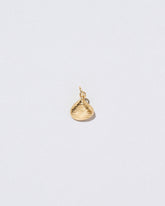 Clams Casino Charm on light color background.