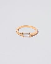 Alcon Ring on light color background.