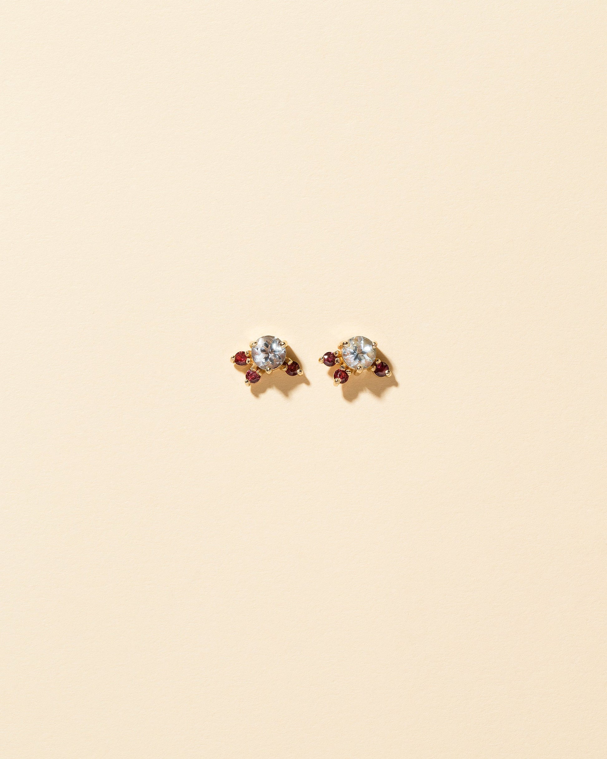  Aquamarine & Garnet Earrings on light color background.