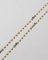 Streamer Chain Necklace on light color background.