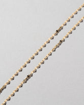 Streamer Chain Necklace on light color background.