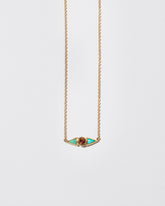Sunstone & Turquoise Eye Necklace on light color background.