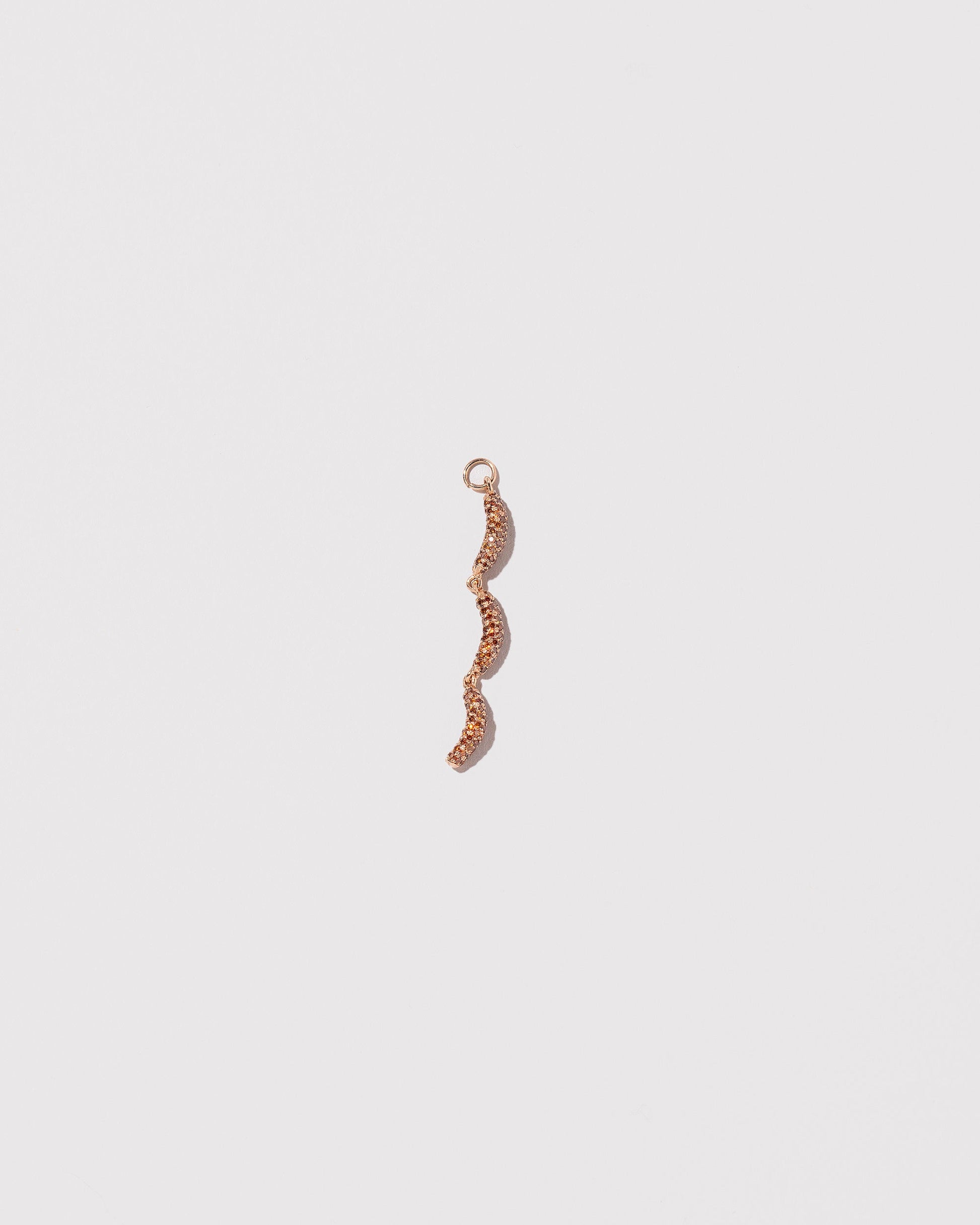 Sausage Links Charm on light color background.