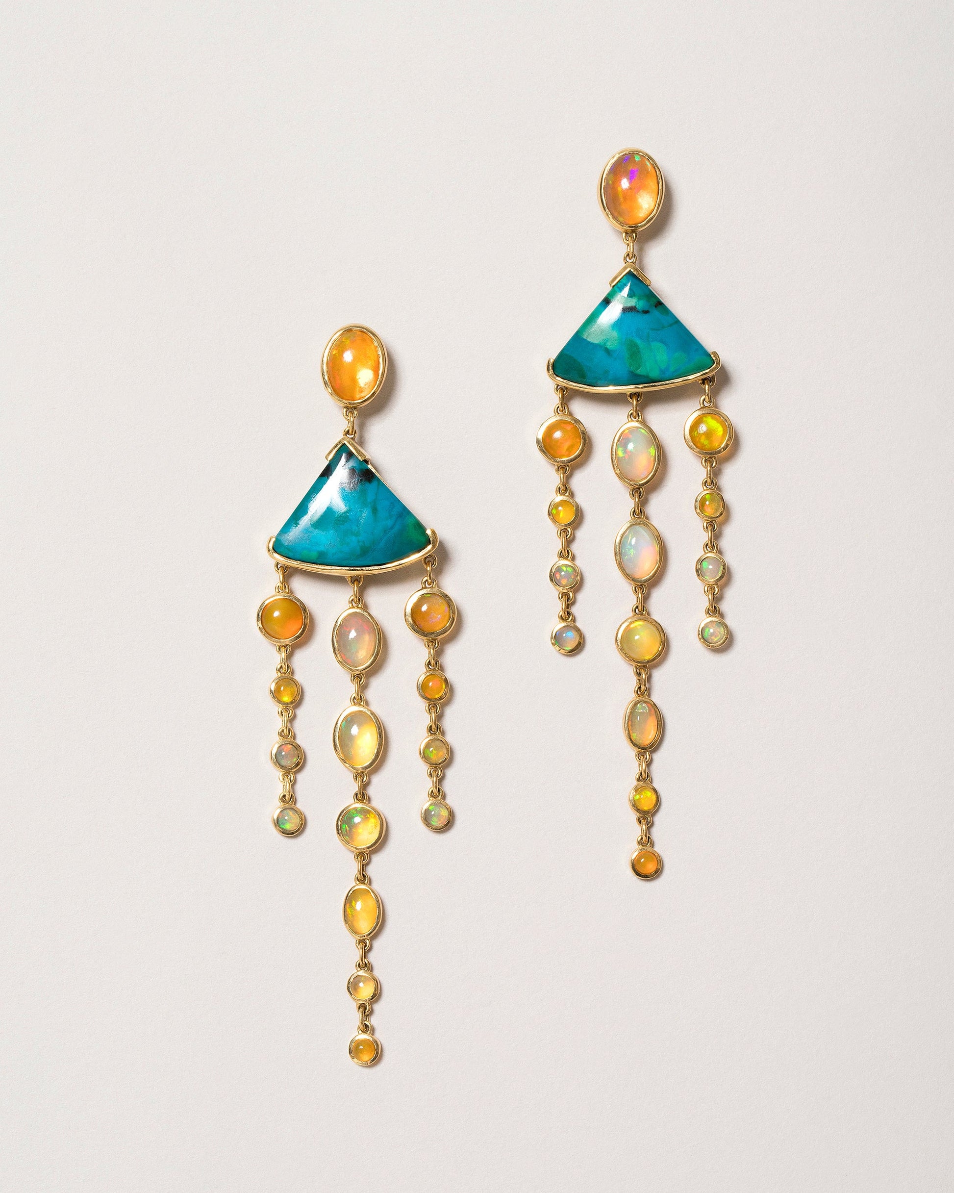 Chrysocolla & Ethiopian Opal Earrings on light color background.