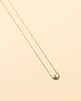 Moon Ray Necklace on light color background.