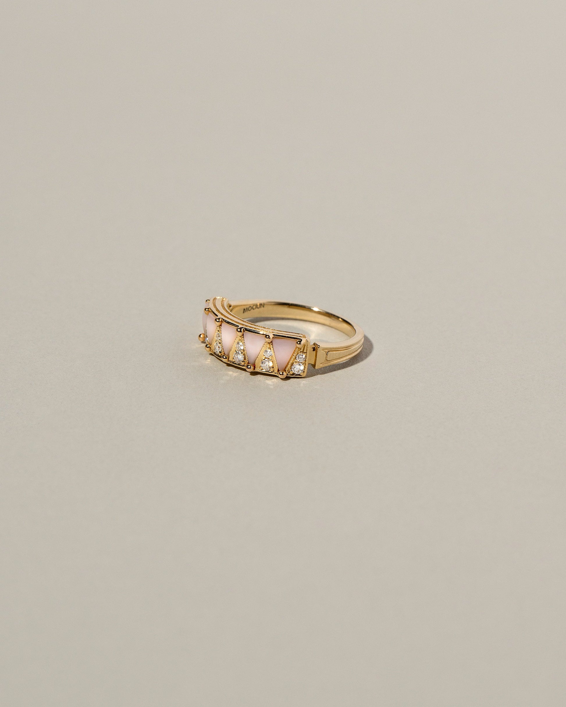 Five Triangle Ring - Pink Opal on light color background.