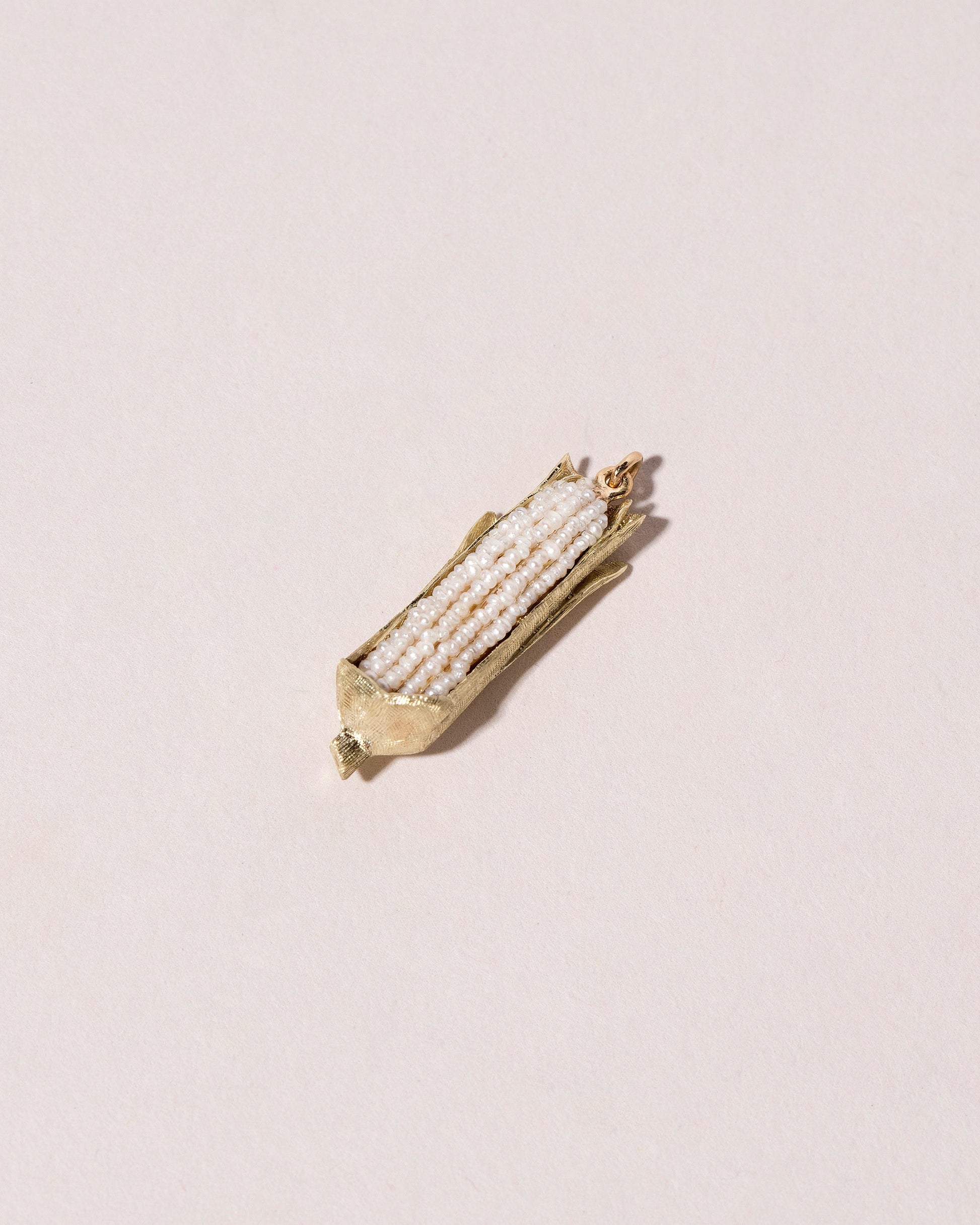 Corn on the Cob Charm on light color background.