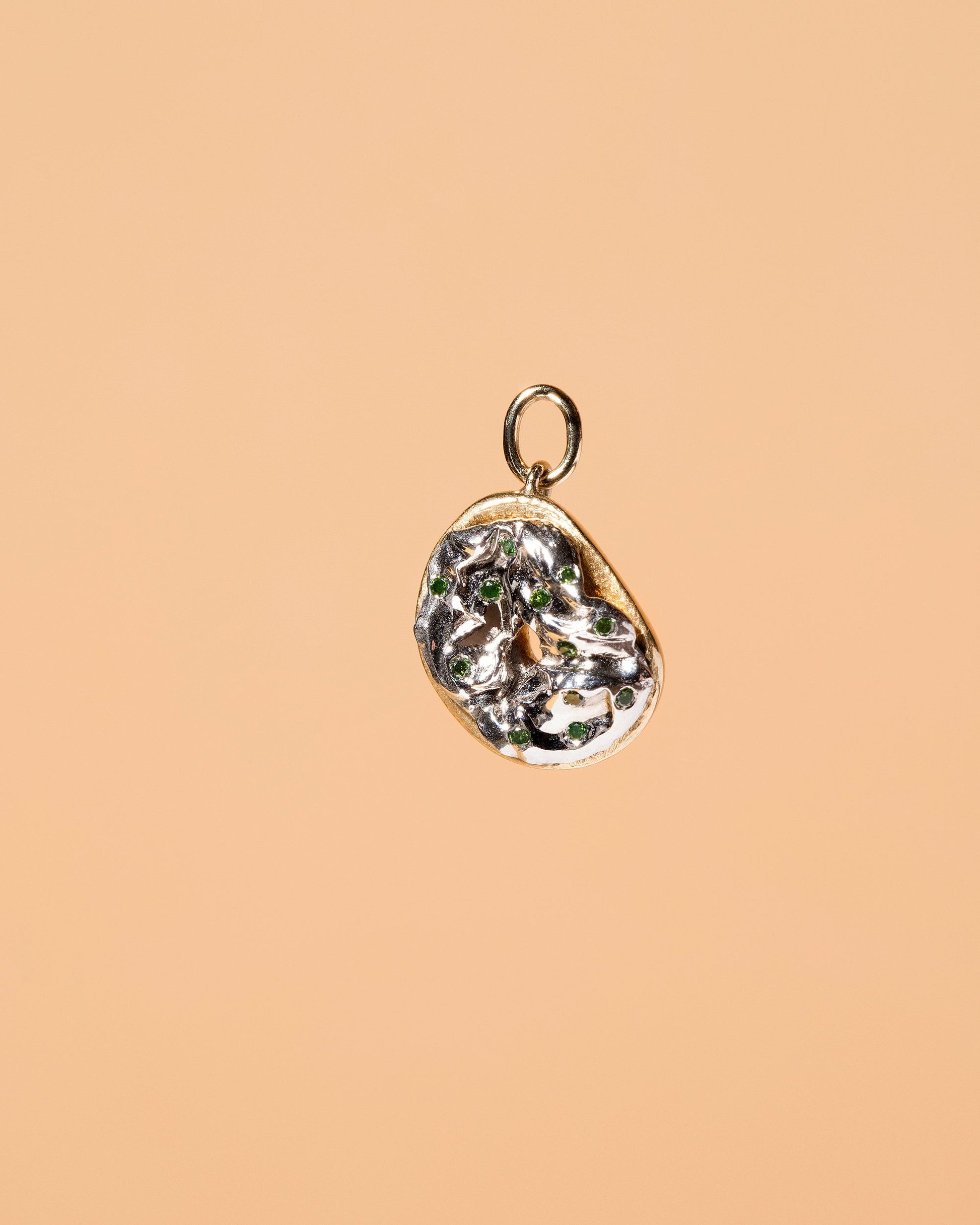 Poppy Seed Bagel Charm with Cream Cheese & Chives on light color background.