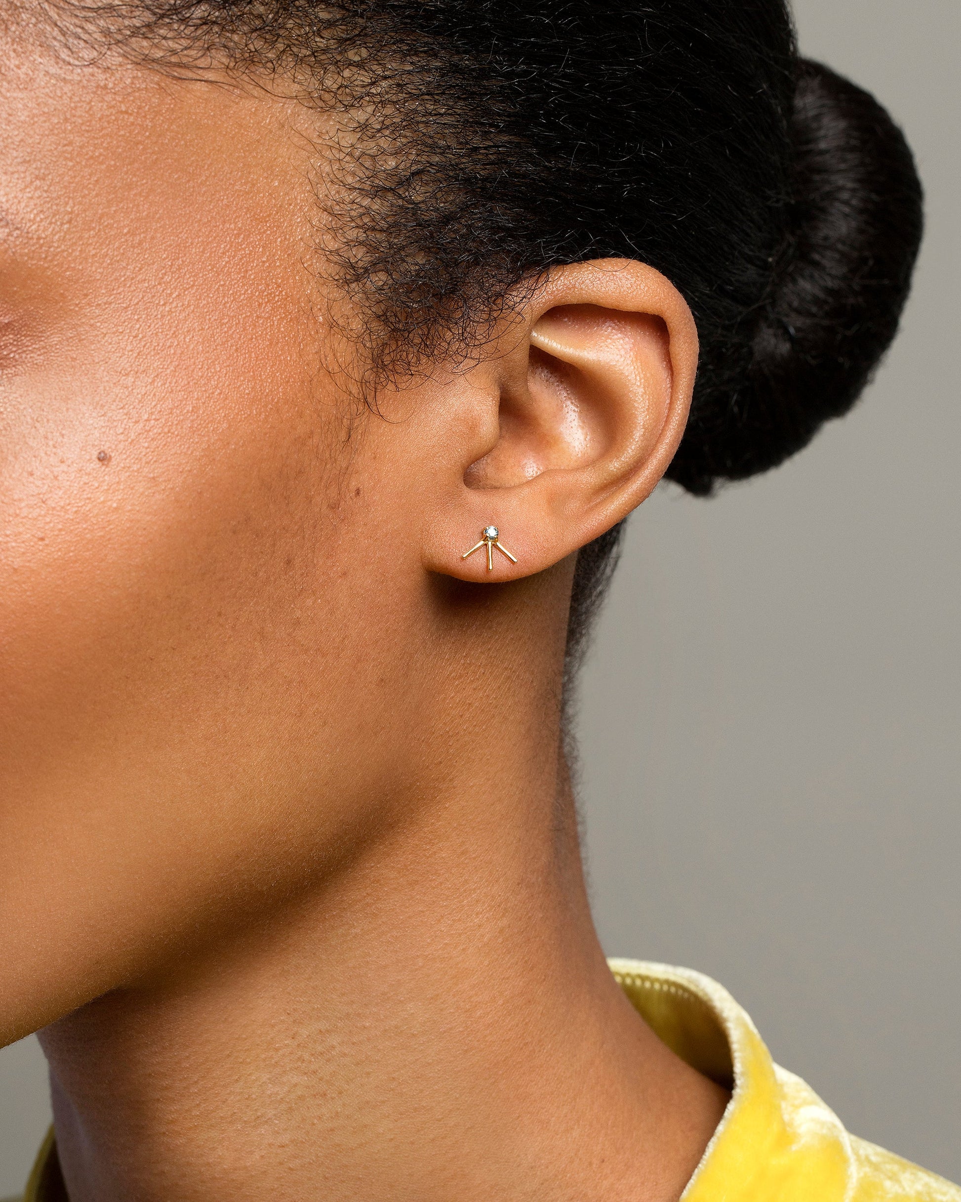 Aquamarine Sun Ray Stud Earring Single on model.