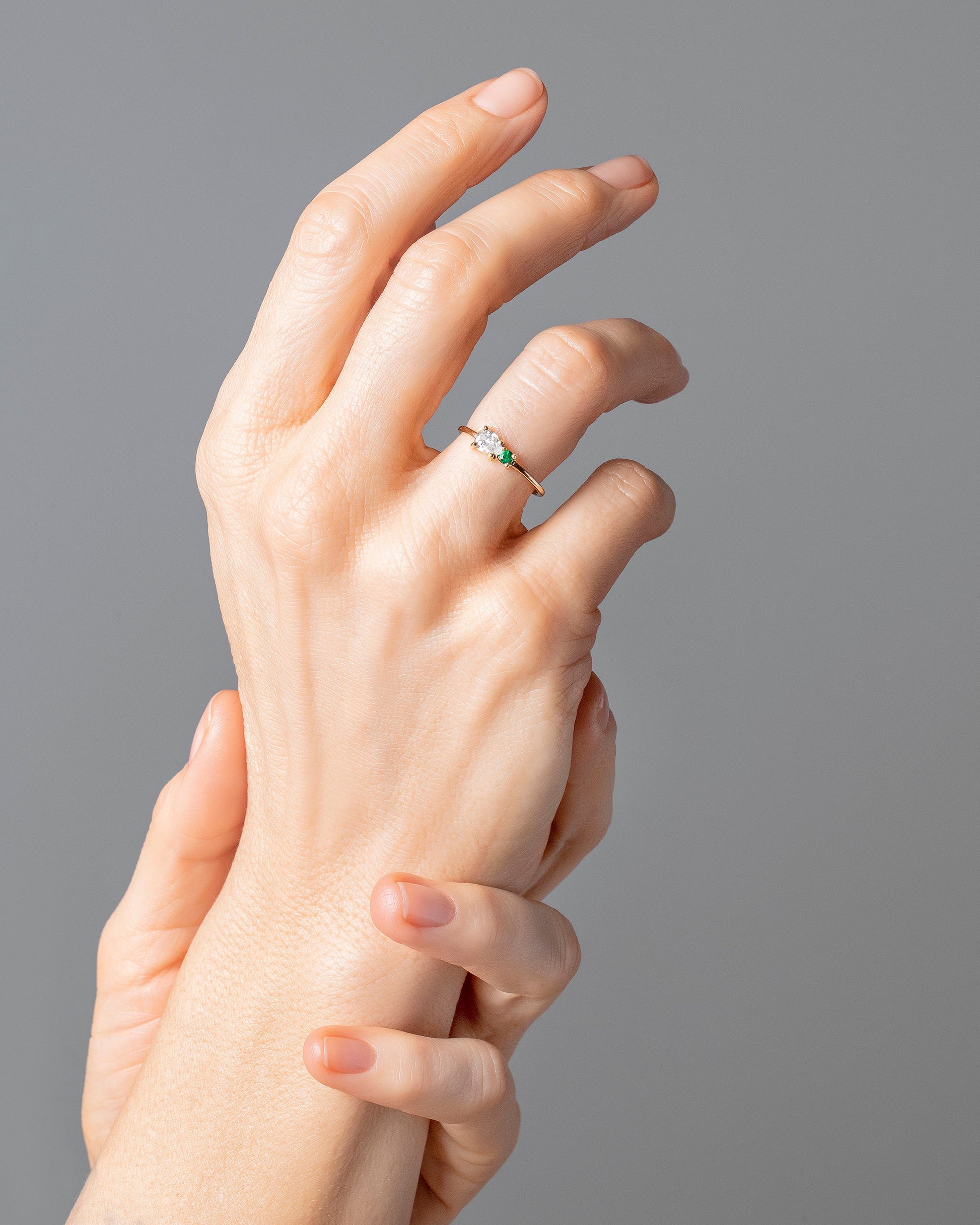 Teardrop Ring - Diamond & Emerald on model.