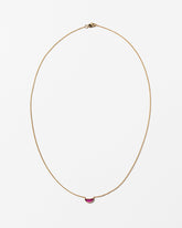 Desire Necklace on light color background.