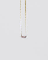 Sweet Heart Necklace on light color background.