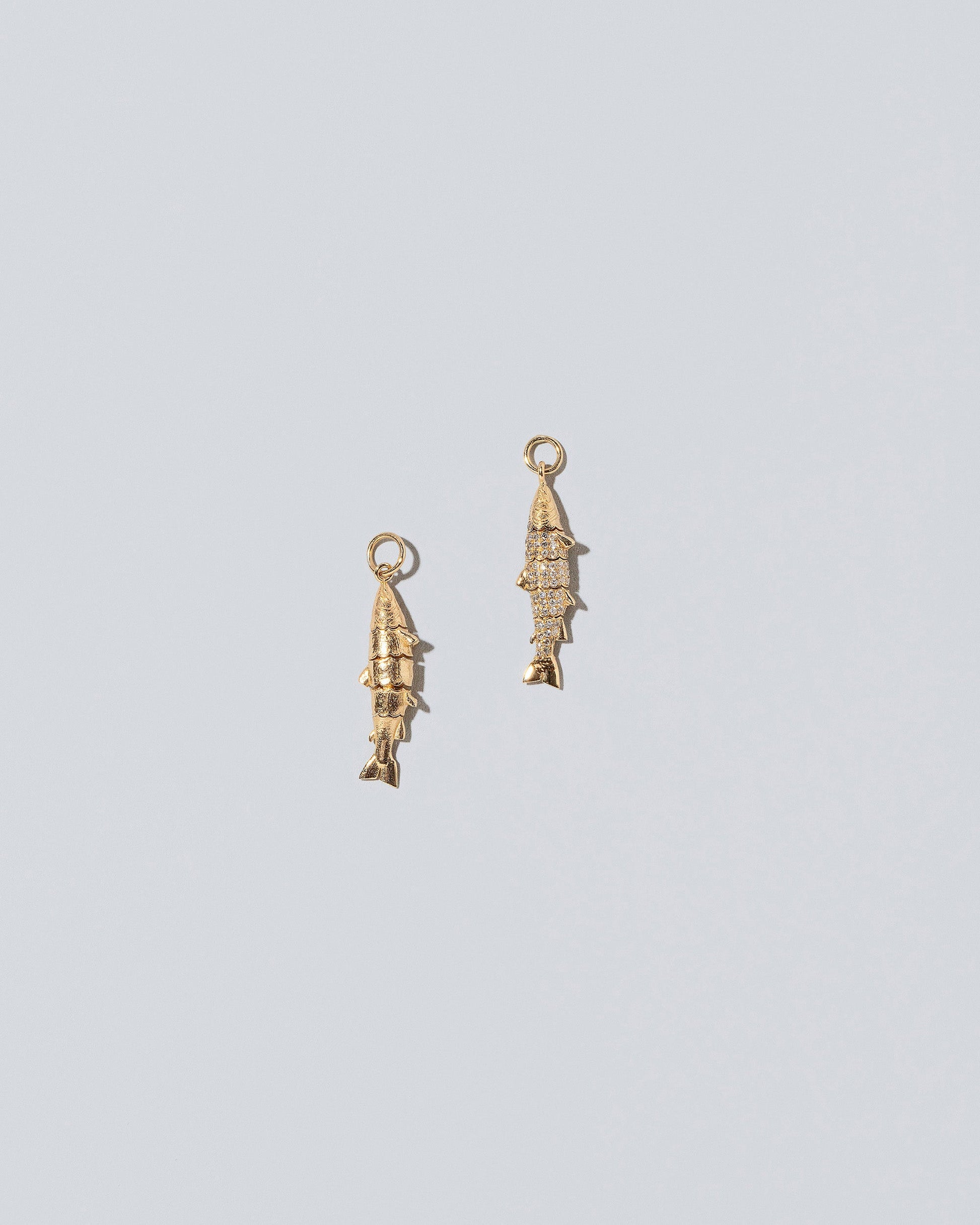 Fish Charms - Diamond and Solid on light color background.