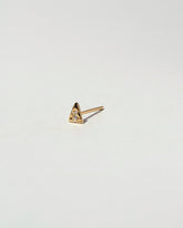 Gold White Diamond Triangle Stud Earring Single on light color background.