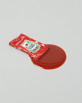 Spills Ketchup Pack Condiment Pack on light color background.