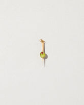 Martini Olive Charm on light color background.