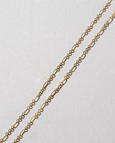Closeup details of the Abacus Chain Necklace on light color background.