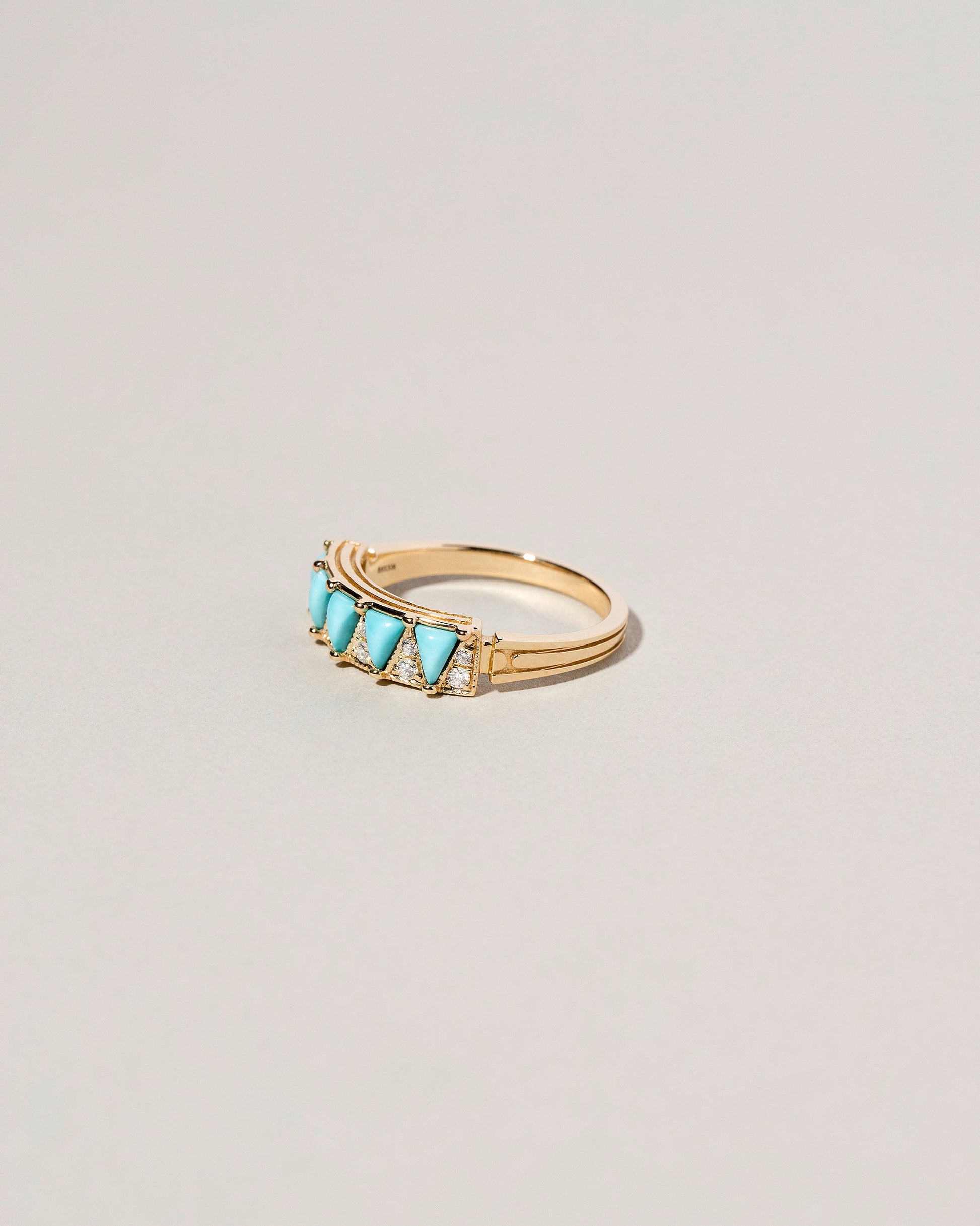 Five Triangle Ring - Turquoise on light color background.