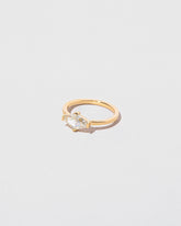 View from the side of the Divine Geometry Ring on light color background.