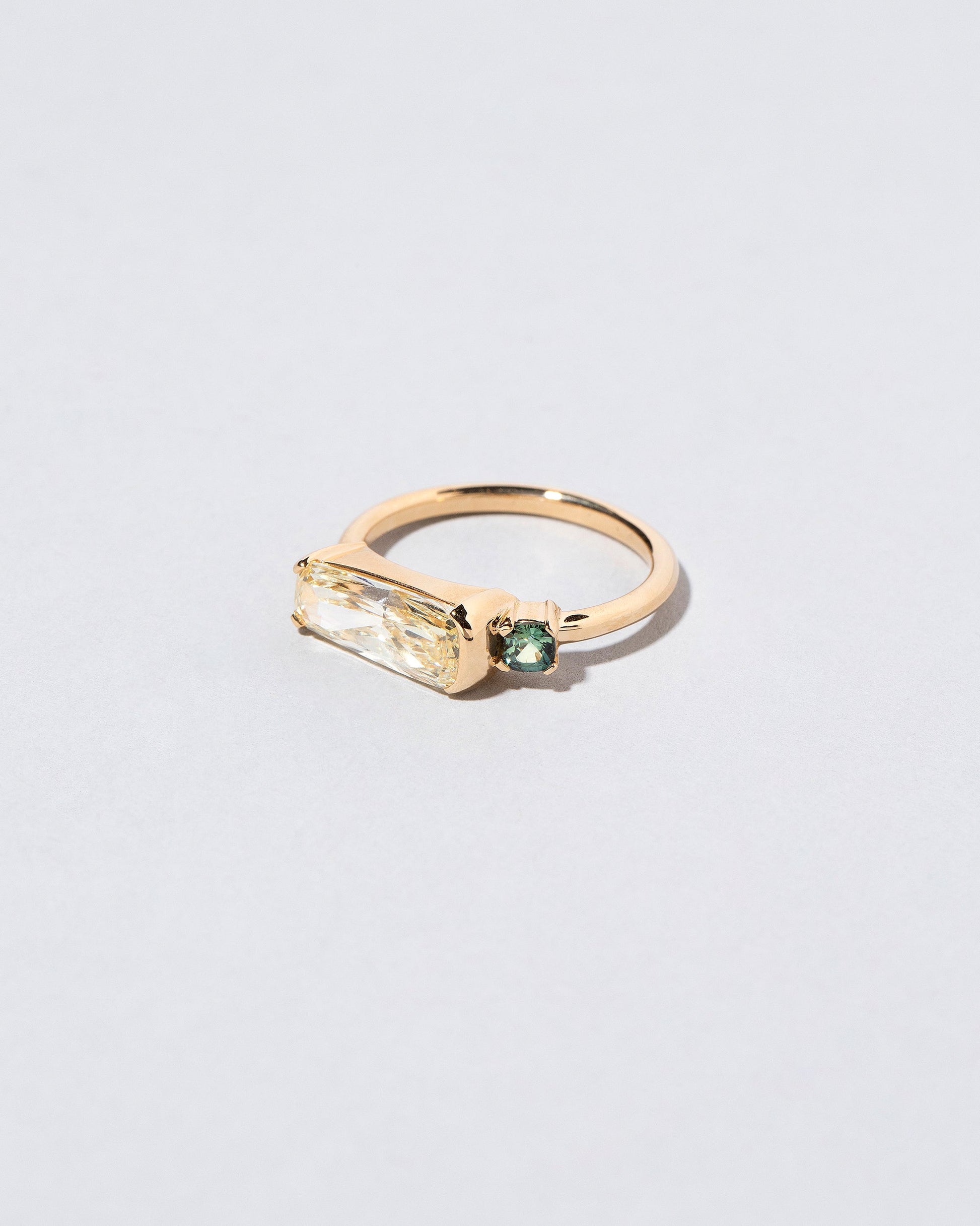 Immanence Ring on light color background.