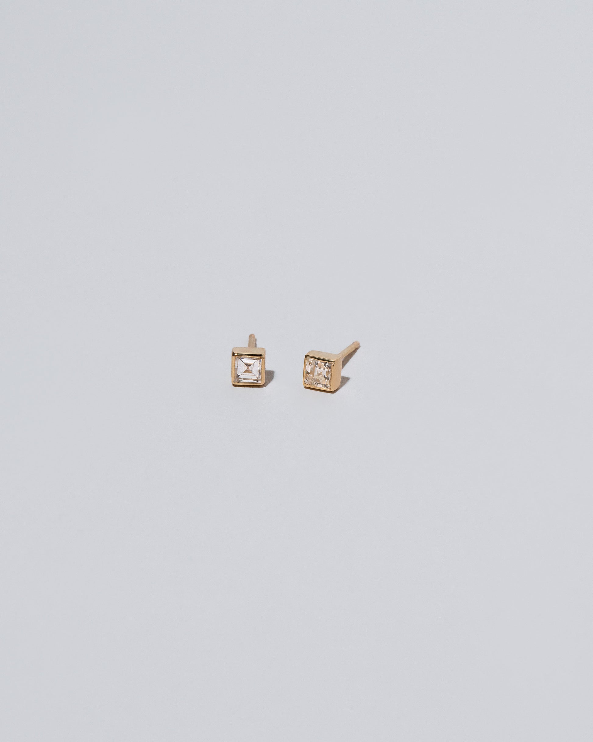 Square Stud - White Diamond on light color background.